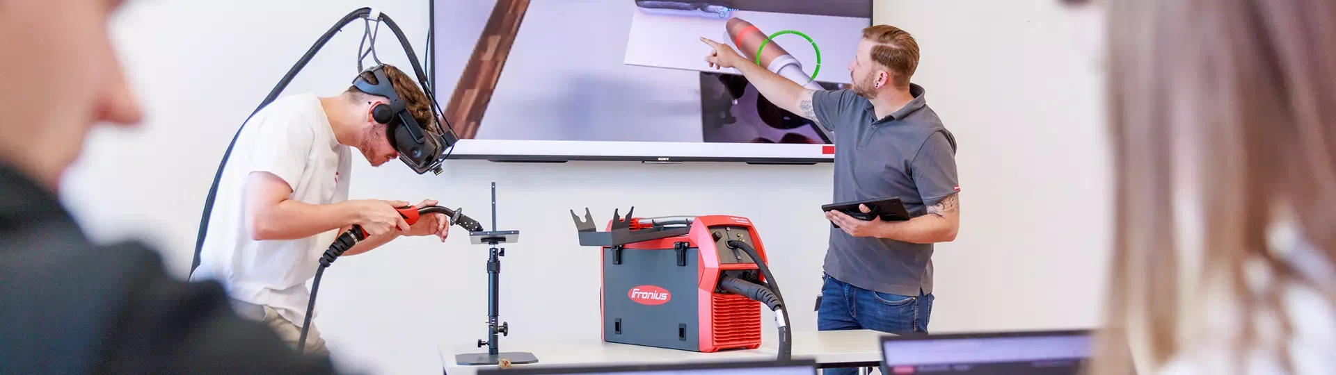 Young people welding with the Welducation Simulator